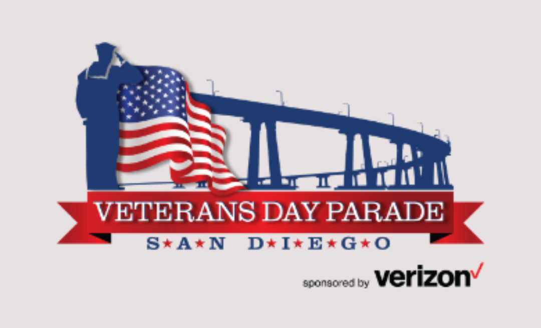 Logo for the Veterans Day Parade in San Diego, featuring a saluting silhouette, an American flag, and a bridge, with sponsorship by Verizon.